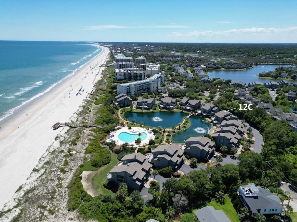 Aerial view of Breakers Reef condo rentals, the pool, lagoon and beach in Litchfield by the Sea, SC