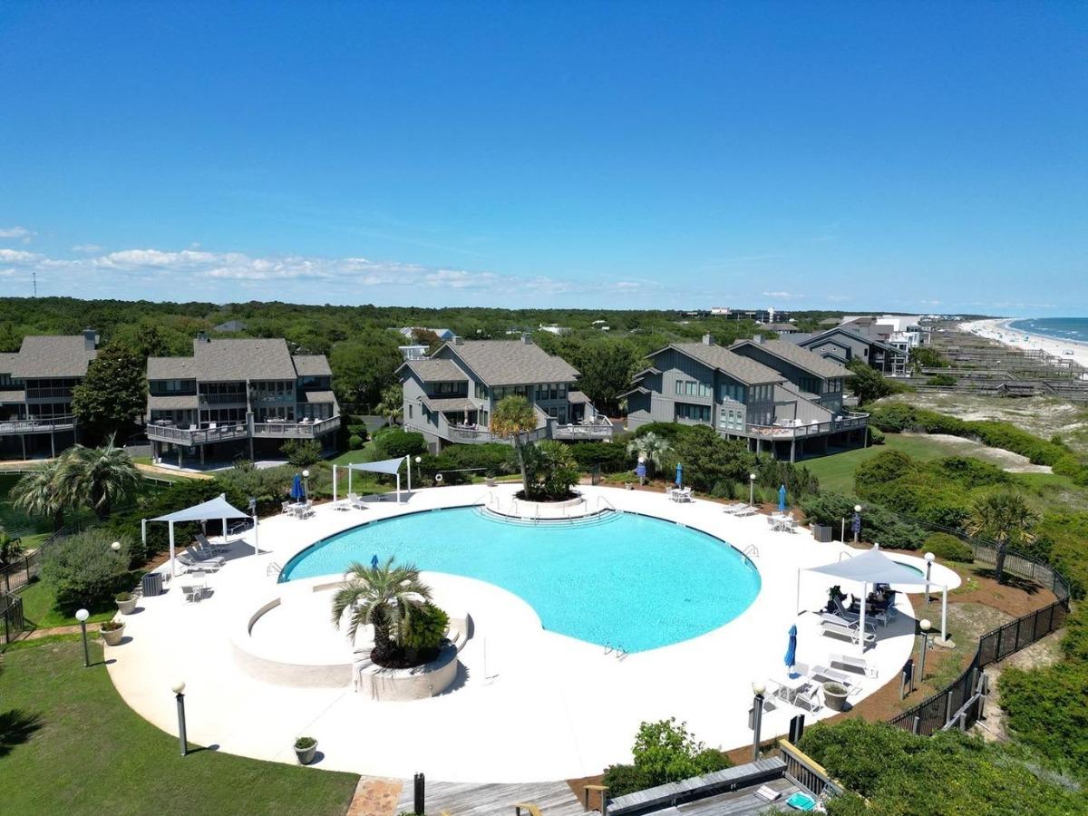 Aerial view of the resort pool and Breakers Reef vacation rentals with the beach in the distance, Litchfield by the Sea, SC