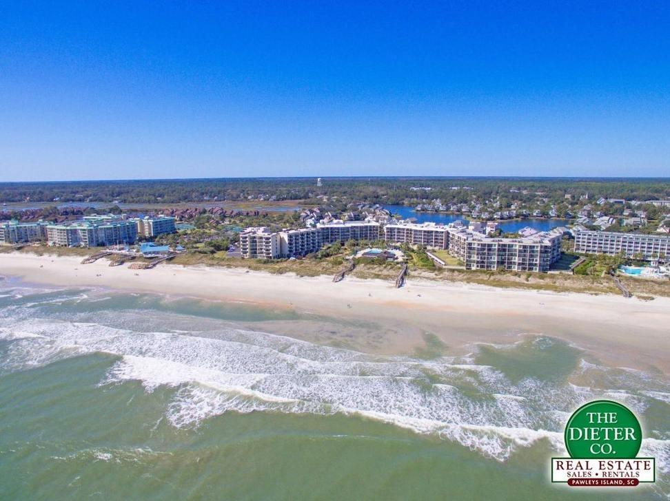 Aerial view of the beach and condo buildings at Litchfield by the Sea rentals, SC