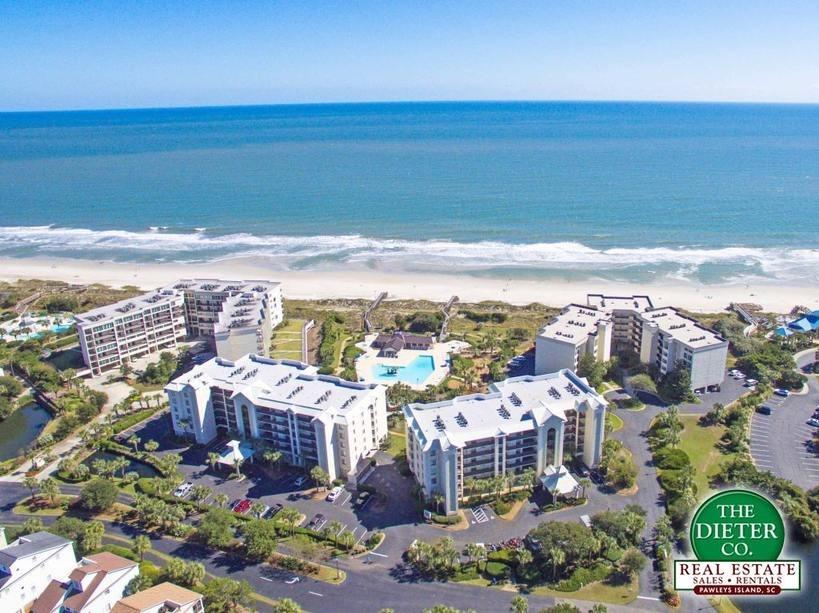 Aerial view of oceanfront condo buildings and pool at Litchfield by the Sea rentals, SC